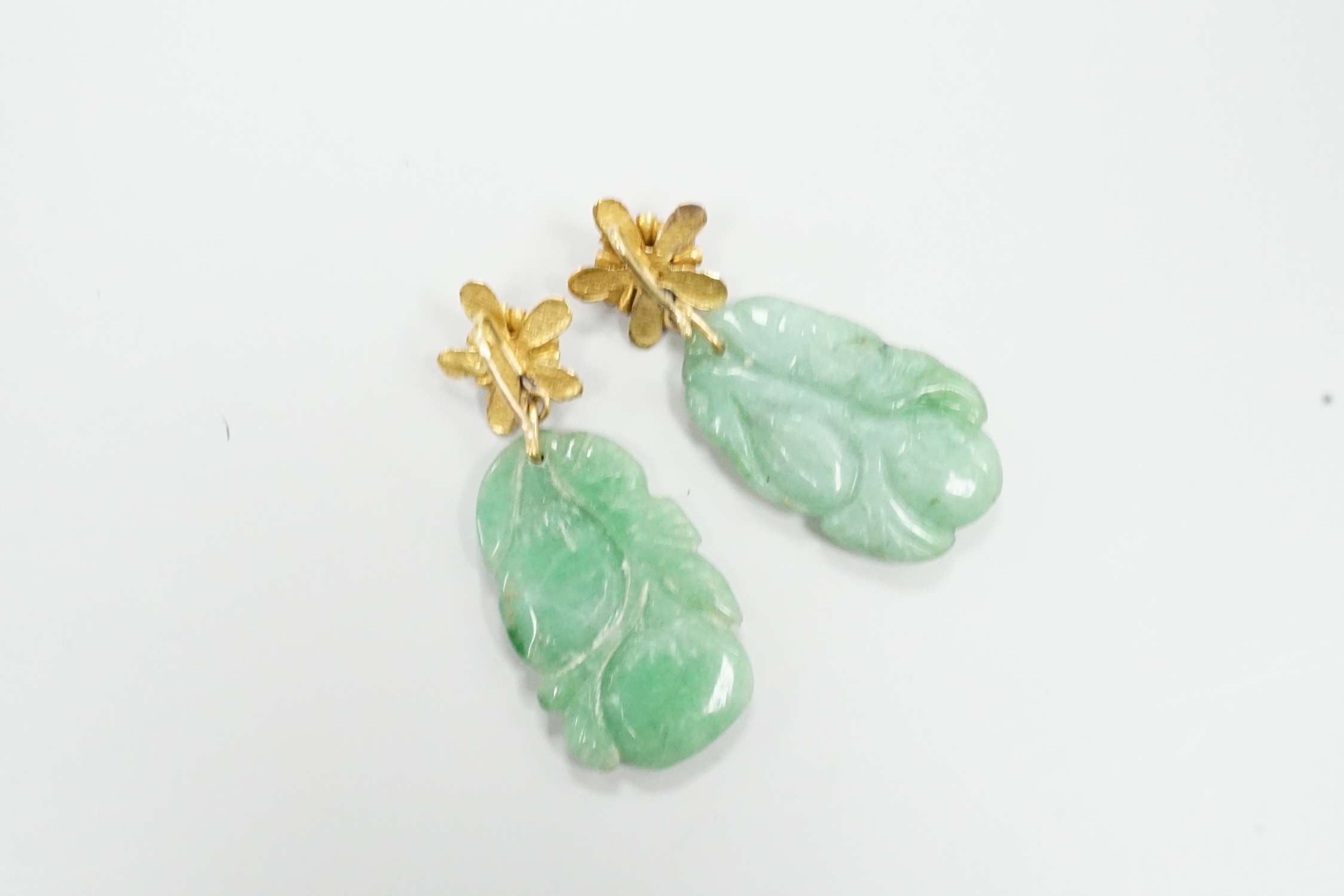 A pair of yellow metal and carved jade earrings, jade 30mm.